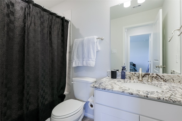 full bathroom featuring vanity, toilet, and shower / bath combo