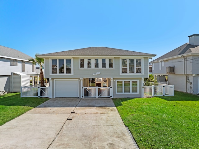 rear view of house featuring a lawn, central AC unit, and a garage