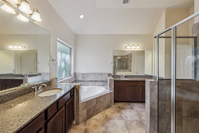 bathroom with plus walk in shower, tile patterned flooring, vanity, and vaulted ceiling