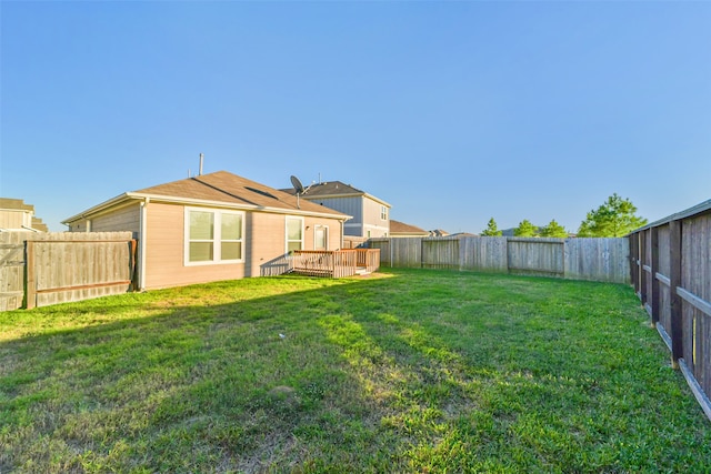 view of yard featuring a deck