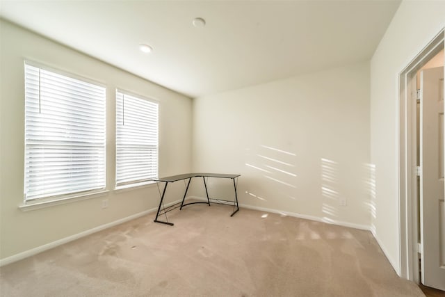 empty room with light colored carpet