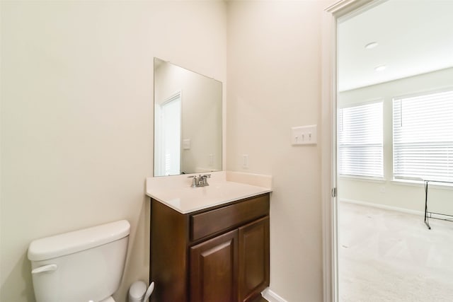 bathroom featuring vanity and toilet