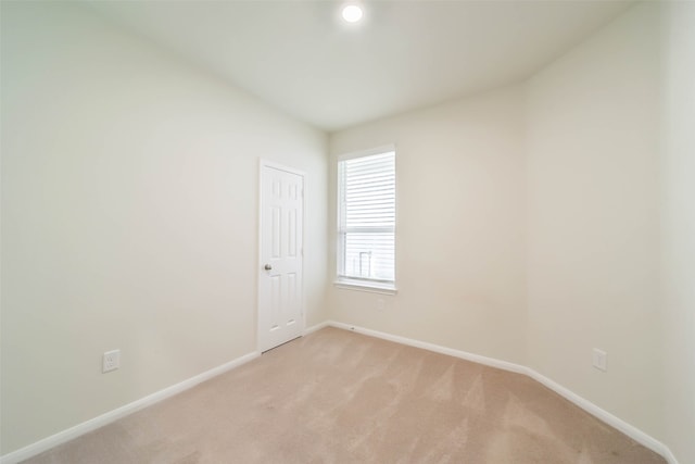 empty room with light colored carpet