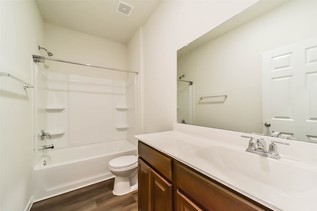 full bathroom featuring vanity, toilet, wood-type flooring, and shower / washtub combination