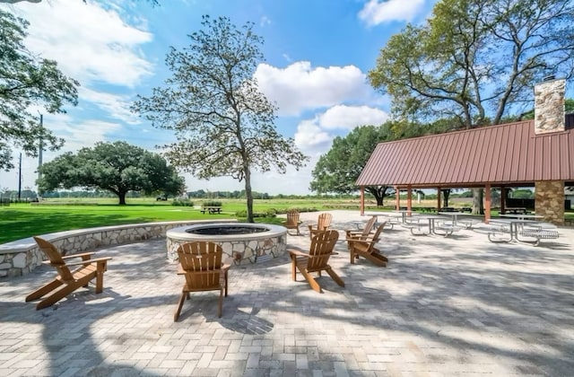 surrounding community with a gazebo, an outdoor fire pit, and a patio