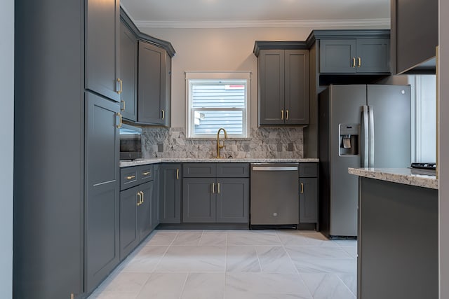 kitchen featuring decorative backsplash, light stone countertops, sink, and appliances with stainless steel finishes