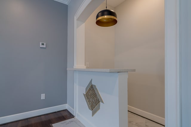 details with hardwood / wood-style floors and crown molding