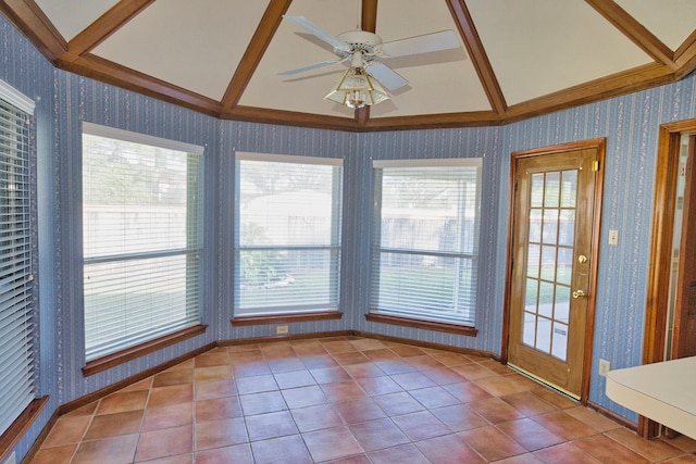 unfurnished sunroom featuring ceiling fan and vaulted ceiling