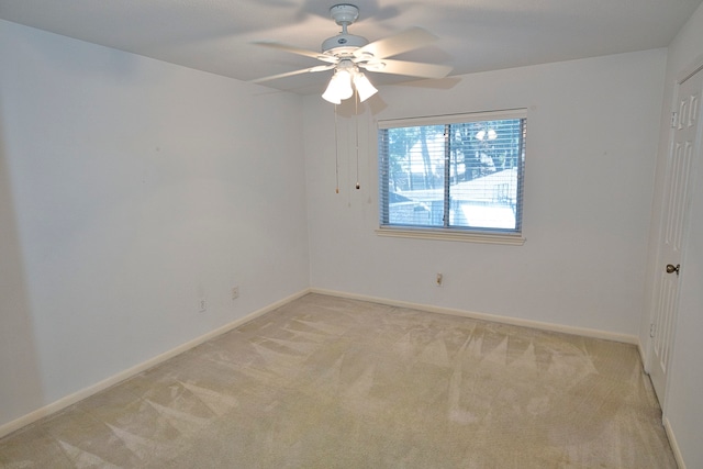 empty room with light carpet and ceiling fan