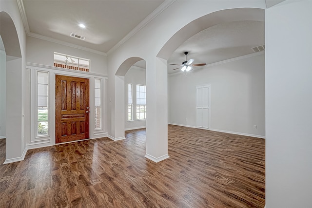 entryway with ceiling fan, crown molding, and dark wood-type flooring