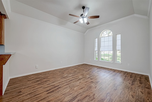 empty room with ceiling fan, crown molding, lofted ceiling, and dark wood-type flooring