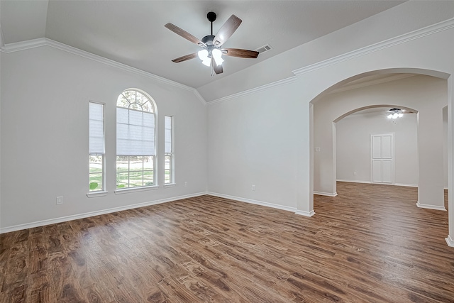 unfurnished room featuring crown molding, ceiling fan, dark wood-type flooring, and lofted ceiling