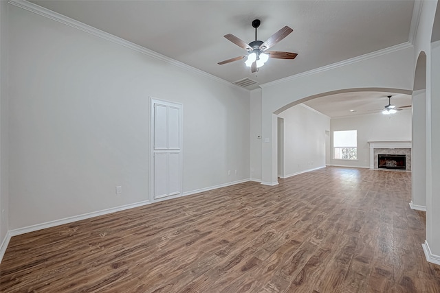 unfurnished living room featuring hardwood / wood-style flooring, ceiling fan, and ornamental molding