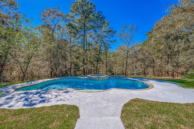 view of swimming pool with an in ground hot tub