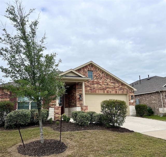 view of front of home with a front yard and a garage