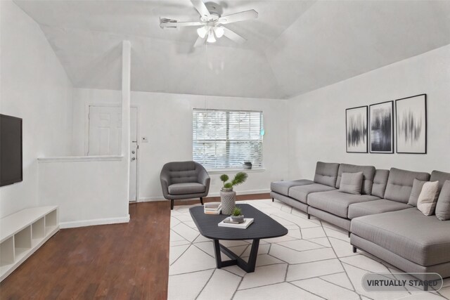 living room featuring hardwood / wood-style flooring, ceiling fan, and lofted ceiling