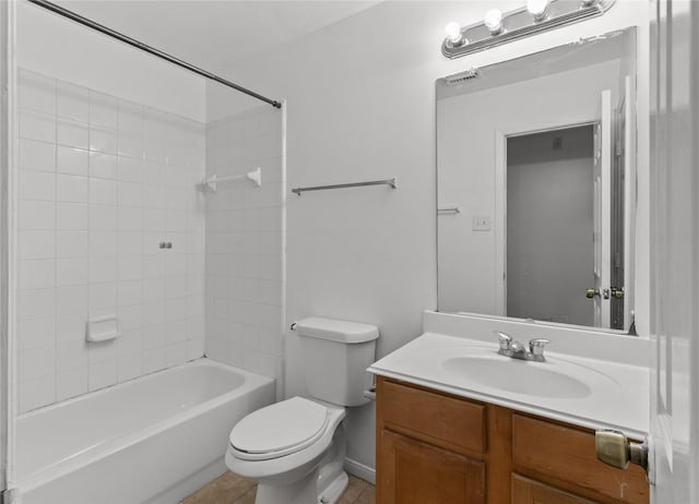 full bathroom with vanity, toilet, and tiled shower / bath combo