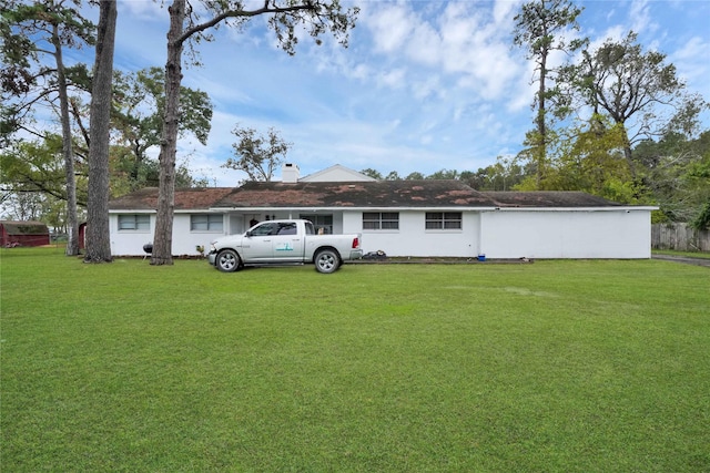 back of house with a yard