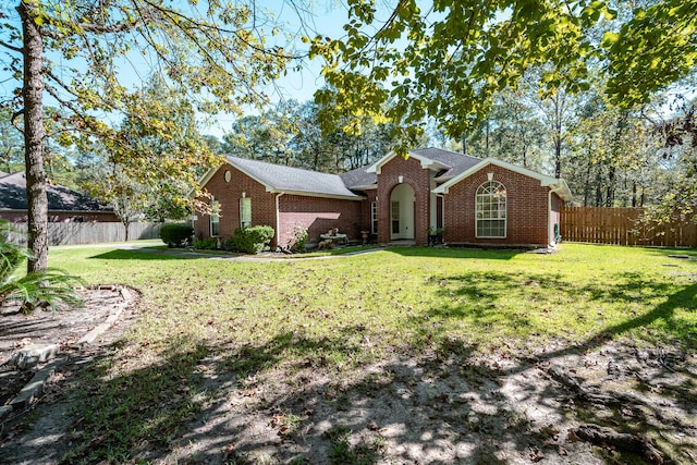 ranch-style home with a front yard