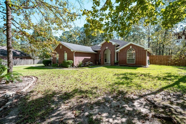 206 Private Road 635, Dayton, TX 77535 - view of front facade with brick siding and roof with shingles