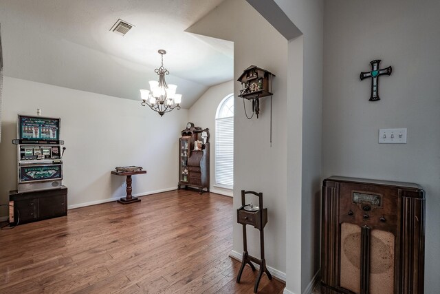 206 Private Road 635, Dayton, TX 77535 - foyer with a chandelier, wood finished floors, vaulted ceiling, and baseboards