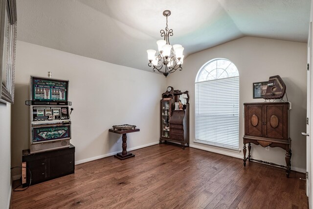 206 Private Road 635, Dayton, TX 77535 - empty room with vaulted ceiling, wood finished floors, a chandelier, and baseboards