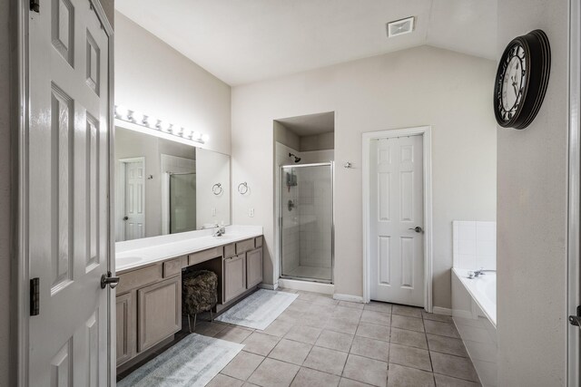 206 Private Road 635, Dayton, TX 77535 - full bath featuring a stall shower, double vanity, tile patterned floors, a garden tub, and baseboards