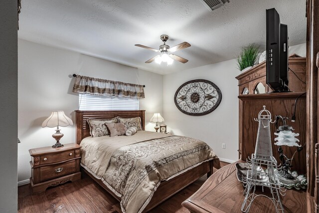 206 Private Road 635, Dayton, TX 77535 - bedroom featuring baseboards, dark wood-style floors, and a ceiling fan