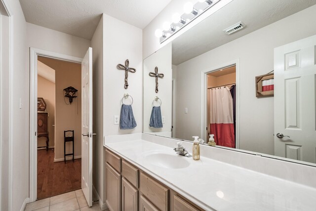 206 Private Road 635, Dayton, TX 77535 - bathroom featuring vanity, tile patterned flooring, and baseboards