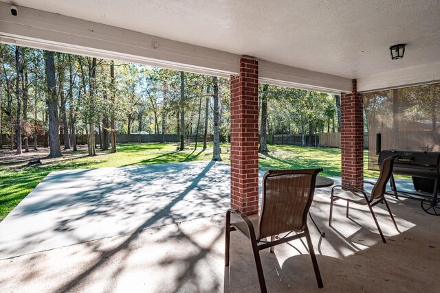 206 Private Road 635, Dayton, TX 77535 - view of patio featuring view of wooded area