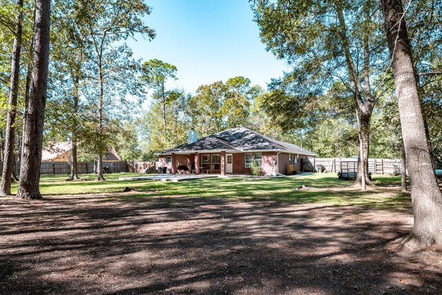 206 Private Road 635, Dayton, TX 77535 - view of side of property with a chimney
