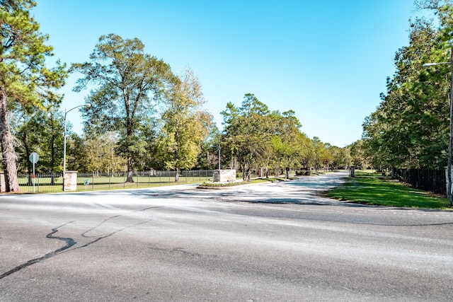 206 Private Road 635, Dayton, TX 77535 - view of asphalt road featuring street lighting and traffic signs