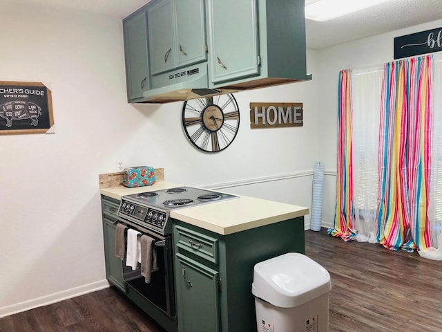 kitchen with electric range oven, dark hardwood / wood-style floors, and green cabinetry