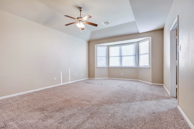 unfurnished room with ceiling fan, light colored carpet, and lofted ceiling