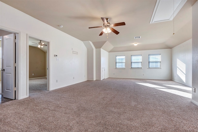 carpeted empty room with ceiling fan and lofted ceiling