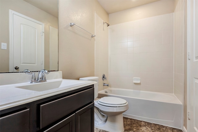 full bathroom featuring tiled shower / bath combo, toilet, and vanity