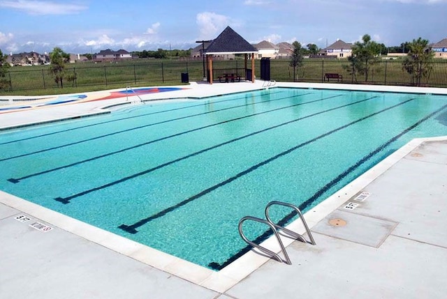 view of swimming pool featuring a gazebo