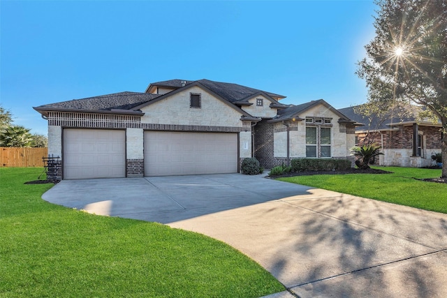 view of front facade with a garage and a front yard