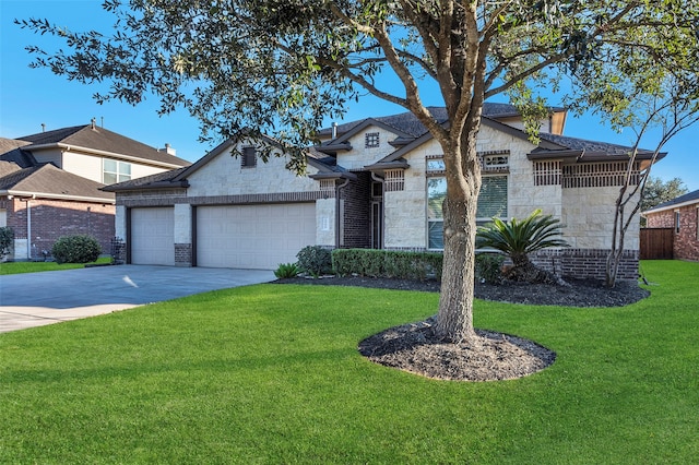 view of front of house with a front lawn and a garage