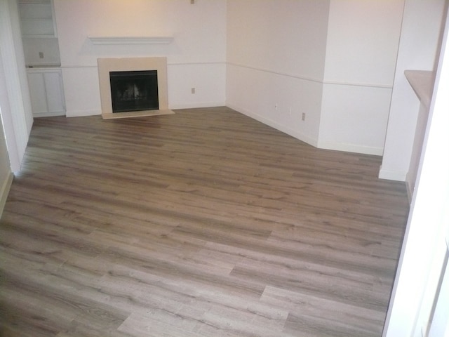 unfurnished living room featuring wood-type flooring