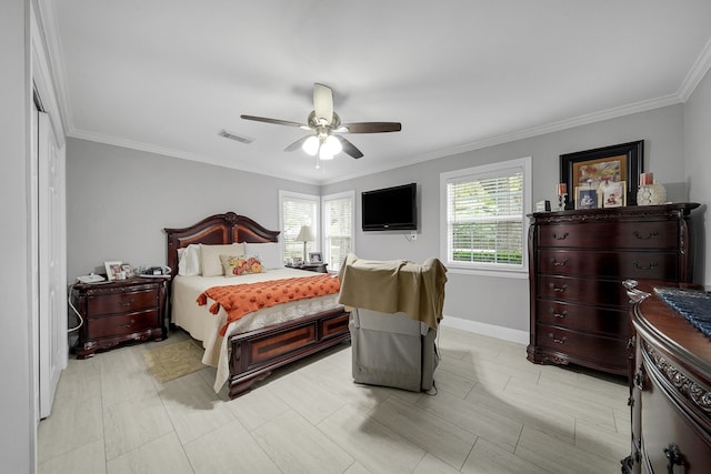 bedroom with ceiling fan and ornamental molding