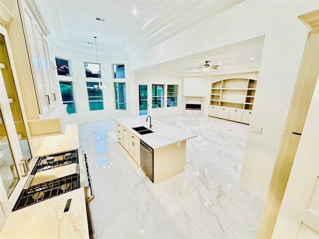 kitchen with ornamental molding, a kitchen island with sink, sink, decorative light fixtures, and dishwasher