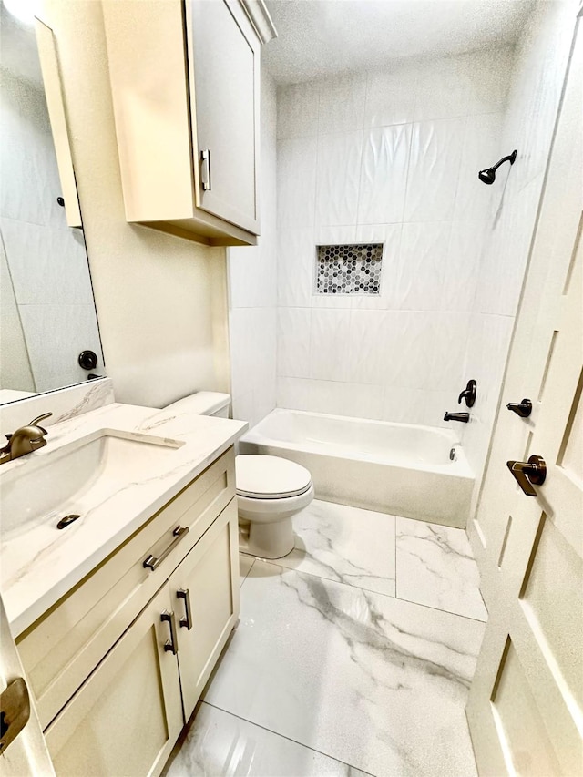 full bathroom featuring vanity, bathtub / shower combination, and toilet