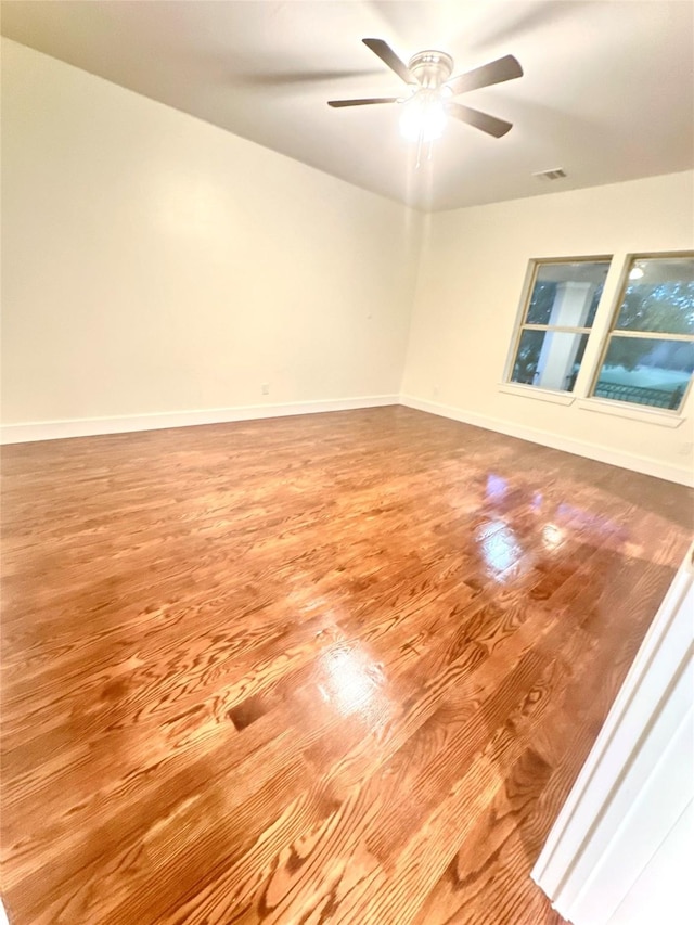 spare room featuring ceiling fan and wood-type flooring