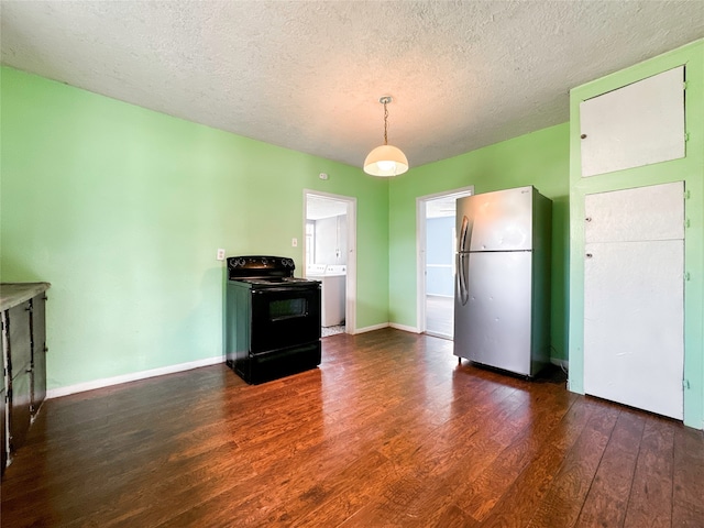 kitchen featuring a textured ceiling, stainless steel refrigerator, dark wood-type flooring, and black / electric stove