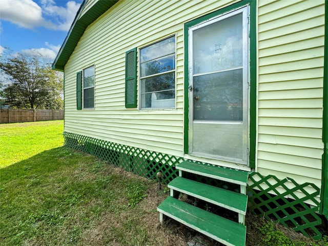 view of side of property with a yard