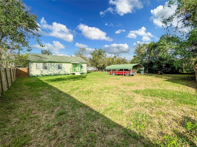 view of yard with a carport