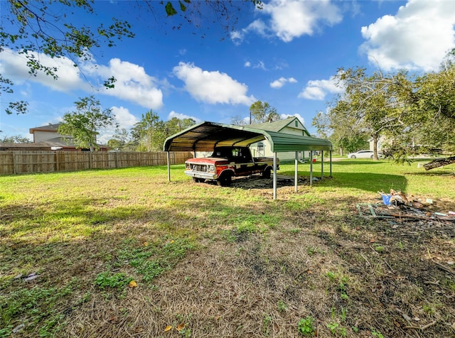 view of yard with a carport