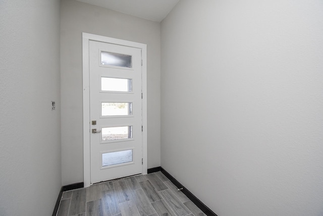 209 Silverleaf Rd, Sweeny, TX 77480 - doorway featuring baseboards and wood finished floors