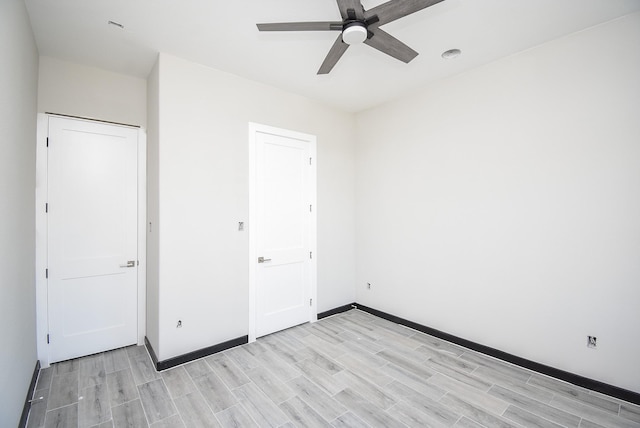 209 Silverleaf Rd, Sweeny, TX 77480 - unfurnished bedroom featuring light wood-type flooring, baseboards, and a ceiling fan